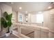 Open loft area with a plant, neutral walls, and white doors leading to the bedrooms at 9807 Panther Hollow St, Las Vegas, NV 89141