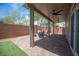 Spacious covered patio with a ceiling fan and outdoor seating, perfect for entertaining guests at 9807 Panther Hollow St, Las Vegas, NV 89141