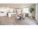 Open concept dining room and kitchen area featuring an island and stainless appliances at 1027 Gentle Swan St # 689, Henderson, NV 89011