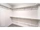 A walk-in closet with white walls and shelving, offering ample storage space at 1027 Gentle Swan St # 689, Henderson, NV 89011
