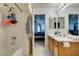 A full bathroom adjacent to the main bedroom, featuring a shower and vanity at 10373 Perfect Parsley St, Las Vegas, NV 89183