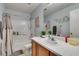 Bright bathroom featuring a shower-tub, toilet, vanity with a mirror, and decor at 10373 Perfect Parsley St, Las Vegas, NV 89183