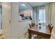 Bright dining area with a view of the kitchen through an arched window at 10373 Perfect Parsley St, Las Vegas, NV 89183