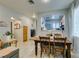 Open concept dining area featuring a view into the kitchen and bright natural light at 10373 Perfect Parsley St, Las Vegas, NV 89183