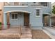 Inviting front entrance featuring a secure screen door, stone steps, and an arched porch at 10373 Perfect Parsley St, Las Vegas, NV 89183