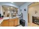 Open kitchen featuring a stainless steel dishwasher, adjacent to an arched entryway at 10373 Perfect Parsley St, Las Vegas, NV 89183