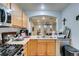 Kitchen featuring a stainless steel dishwasher, double sinks, and white tile backsplash at 10373 Perfect Parsley St, Las Vegas, NV 89183