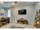 Open-concept living space featuring a dining area and view of the kitchen at 10373 Perfect Parsley St, Las Vegas, NV 89183