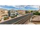 A street featuring well-maintained homes with diverse architectural styles and landscaping at 10373 Perfect Parsley St, Las Vegas, NV 89183