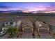 Scenic aerial view of homes with beautiful desert mountain views and colorful sky at 10431 Seelos St, Las Vegas, NV 89178