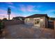 Private backyard patio with desert landscaping and sliding glass door access at 10431 Seelos St, Las Vegas, NV 89178