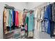 Walk-in closet featuring metal shelving and rods full of colorful folded and hanging clothing at 10431 Seelos St, Las Vegas, NV 89178