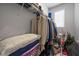 Packed walk-in closet with assorted storage solutions including hanging clothes and wire shelving at 10431 Seelos St, Las Vegas, NV 89178