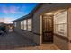 Side view of house featuring a gated entry to backyard and brick-paved walkway at 10431 Seelos St, Las Vegas, NV 89178