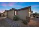 Features desert landscaping, side yard, and neutral color palette at 10431 Seelos St, Las Vegas, NV 89178