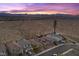 New home with desert landscaping, driveway, and mountain views at sunset at 10431 Seelos St, Las Vegas, NV 89178