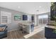 Bright eat-in kitchen area featuring a breakfast bar, granite countertops, and outdoor patio access at 10431 Seelos St, Las Vegas, NV 89178