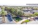 Aerial view of a neighborhood entrance with lush greenery and well-maintained landscaping at 10902 Pentland Downs St, Las Vegas, NV 89141