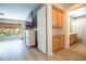 A bedroom shows access to the bathroom, storage cabinets, and a large television at 10902 Pentland Downs St, Las Vegas, NV 89141