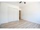 Bright bedroom features wood-look floors and a closet with sliding doors at 10902 Pentland Downs St, Las Vegas, NV 89141
