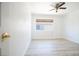 Bright bedroom with wood-look flooring and a large window for natural light at 10902 Pentland Downs St, Las Vegas, NV 89141