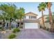 Charming two-story home with a well-maintained brick driveway and mature landscaping at 10902 Pentland Downs St, Las Vegas, NV 89141