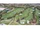 An aerial view of the lush green golf course near 10902 Pentland Downs with ponds and manicured fairways at 10902 Pentland Downs St, Las Vegas, NV 89141