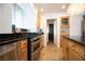 Bright kitchen featuring stainless steel appliances, granite countertops, and wood cabinetry at 10902 Pentland Downs St, Las Vegas, NV 89141