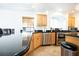 Spacious kitchen with stainless steel appliances, dark granite countertops, and ample cabinet space at 10902 Pentland Downs St, Las Vegas, NV 89141