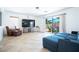 Inviting living room featuring tiled flooring, comfortable seating, and access to the outdoor patio at 10902 Pentland Downs St, Las Vegas, NV 89141