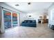 Open-concept living area with a view of the pool through sliding glass doors and comfortable seating at 10902 Pentland Downs St, Las Vegas, NV 89141