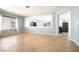Open-concept living room features tiled floors, bright blue walls and a large window at 10902 Pentland Downs St, Las Vegas, NV 89141