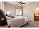Bedroom with a ceiling fan, double windows, and a bathroom entrance at 1413 Gentle Brook St, North Las Vegas, NV 89084