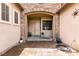 Welcoming entryway featuring a stone-accented archway, double doors, and a charming sun decoration at 1413 Gentle Brook St, North Las Vegas, NV 89084
