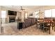 Cozy living area with a fireplace, media center, a dining table, and a neutral color scheme that creates a warm ambiance at 1413 Gentle Brook St, North Las Vegas, NV 89084