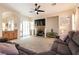 Relaxing living room showcasing a fireplace, neutral tones, and plenty of natural light for a cozy and inviting atmosphere at 1413 Gentle Brook St, North Las Vegas, NV 89084