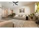 Spacious living room features a neutral palette, a ceiling fan, and large windows for plenty of natural light at 1413 Gentle Brook St, North Las Vegas, NV 89084