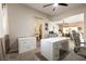 Bright office space featuring a ceiling fan, a large window, neutral paint and well-appointed décor and furnishings at 1413 Gentle Brook St, North Las Vegas, NV 89084
