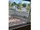 Window view looking into the backyard features a gravel landscaped yard with cinder block perimeter at 1511 Balsam Mist Ave, Las Vegas, NV 89183