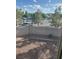 View of the backyard from a window, highlighting gravel, low-maintenance landscaping and block wall at 1511 Balsam Mist Ave, Las Vegas, NV 89183