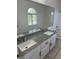 Bathroom featuring double sinks, granite countertops, and modern vanity at 1511 Balsam Mist Ave, Las Vegas, NV 89183
