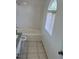 Bright bathroom features a tub, toilet, and vanity with granite countertop under natural light at 1511 Balsam Mist Ave, Las Vegas, NV 89183