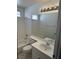 Bright bathroom featuring a tub, white tile and vanity with a large mirror at 1511 Balsam Mist Ave, Las Vegas, NV 89183