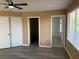 Neutral bedroom with hardwood floors, ceiling fan, and closet with ensuite bathroom and walk-in closet at 1511 Balsam Mist Ave, Las Vegas, NV 89183