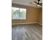 Bedroom with ceiling fan and a window overlooking the street at 1511 Balsam Mist Ave, Las Vegas, NV 89183
