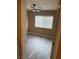A quaint bedroom features a ceiling fan and natural light from a window at 1511 Balsam Mist Ave, Las Vegas, NV 89183