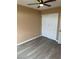 Bright bedroom with hardwood floors, a ceiling fan and closet at 1511 Balsam Mist Ave, Las Vegas, NV 89183