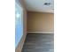 The bedroom features vaulted ceilings, modern flooring, and a bright window at 1511 Balsam Mist Ave, Las Vegas, NV 89183