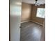 Cozy bedroom with plenty of natural light, ceiling fan, and new flooring that offers a relaxing retreat at 1511 Balsam Mist Ave, Las Vegas, NV 89183