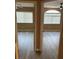 View of two bedrooms with updated floors, and large windows at 1511 Balsam Mist Ave, Las Vegas, NV 89183